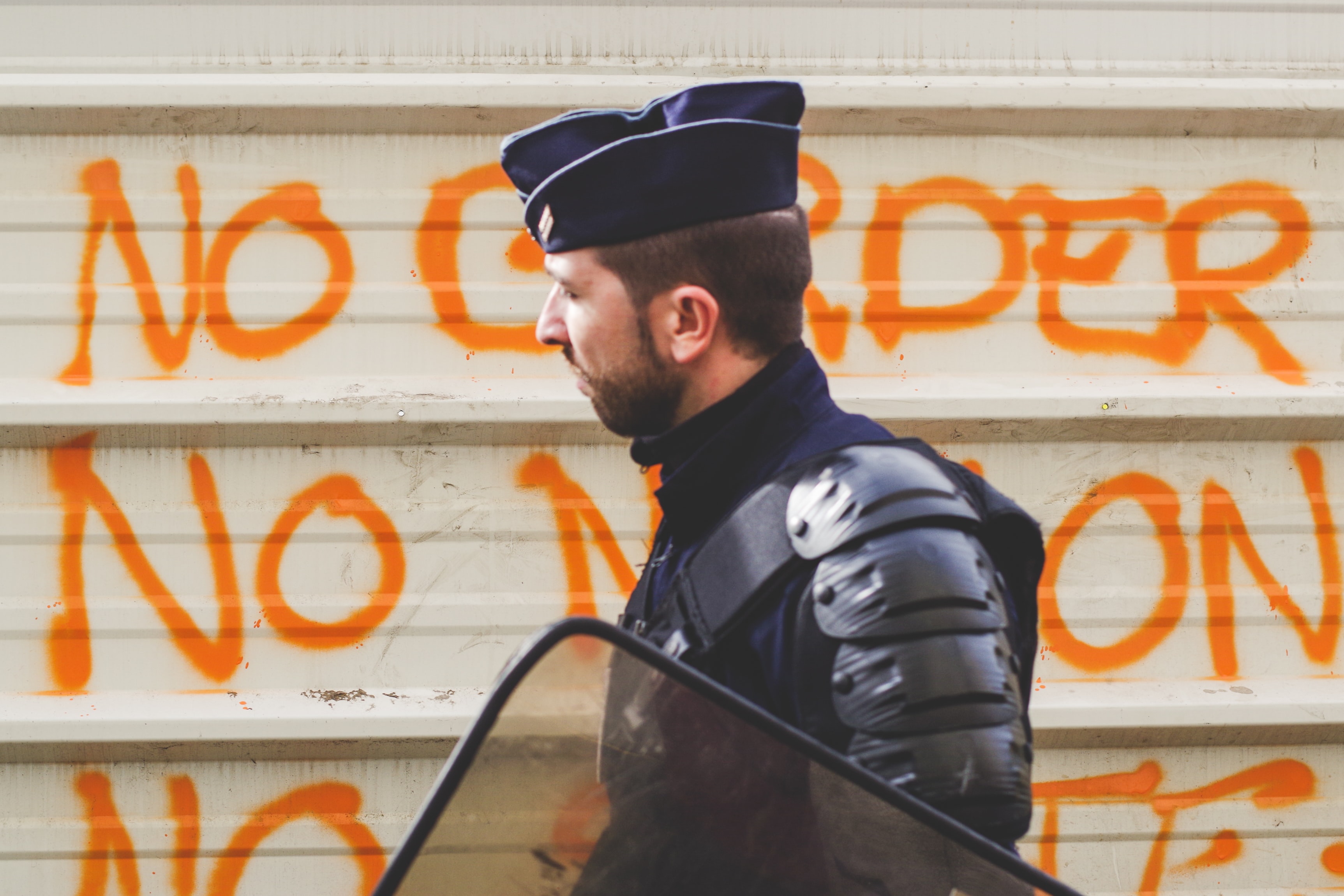 soldier in front of graffiti from unsplash.com