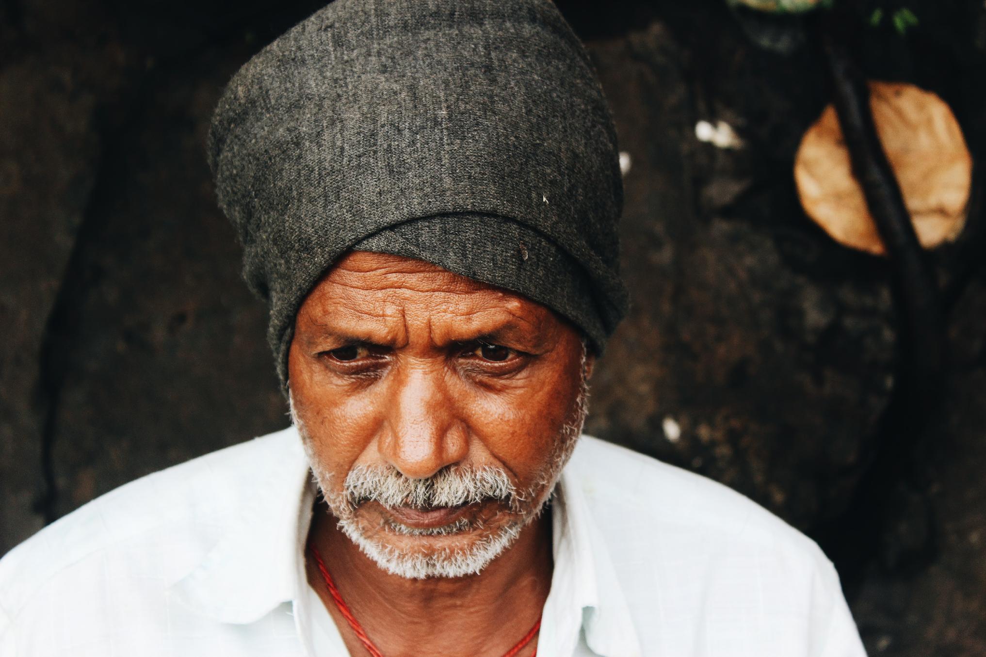 melancholy elderly man by Wilfred Sequeira