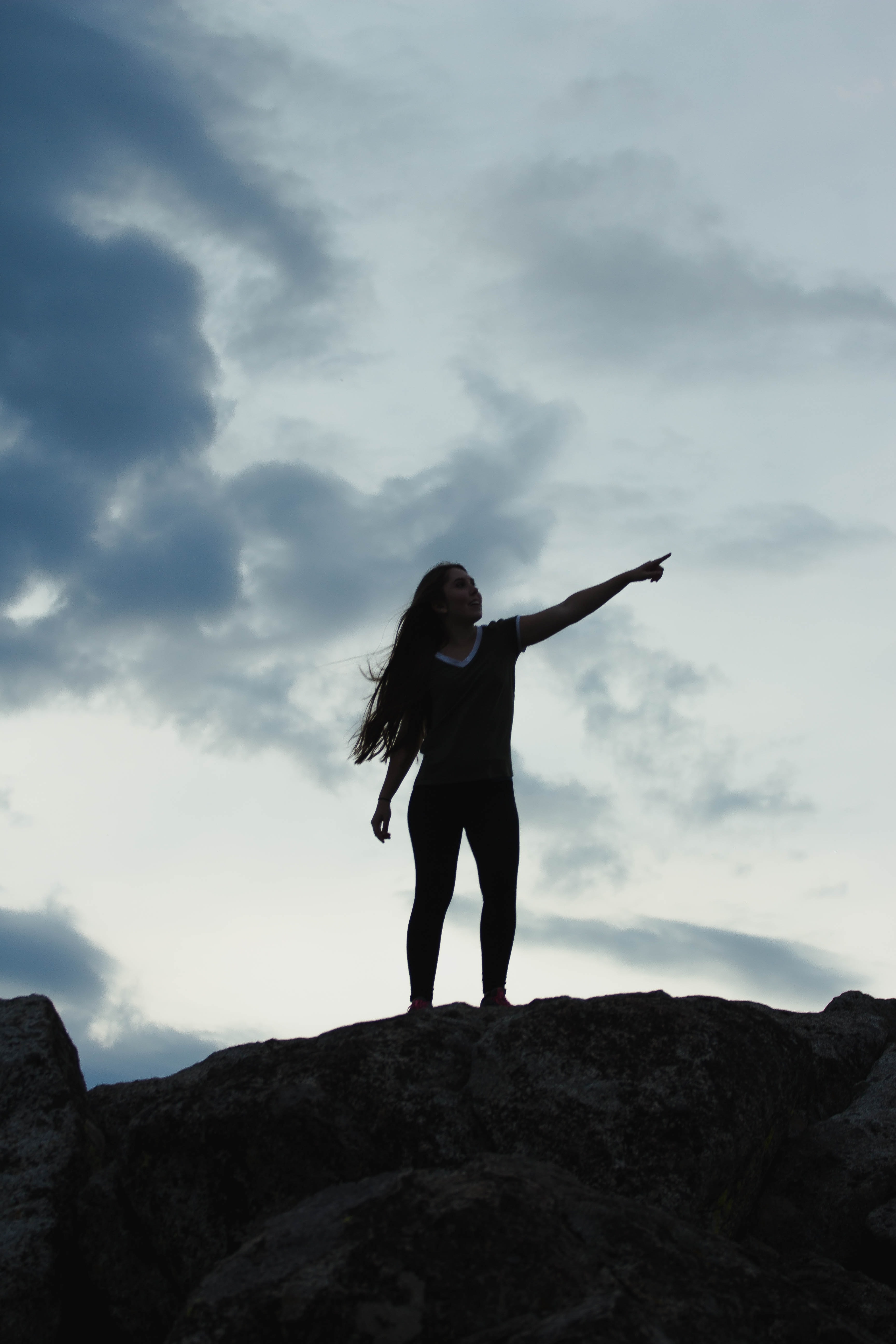 figure standing on a mountaintop by Elijah Hiett